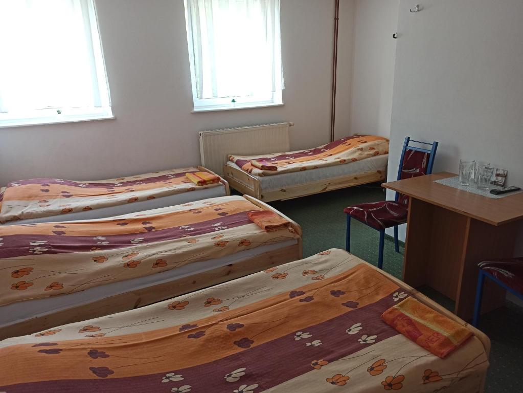 Postel nebo postele na pokoji v ubytování Gościniec Silver