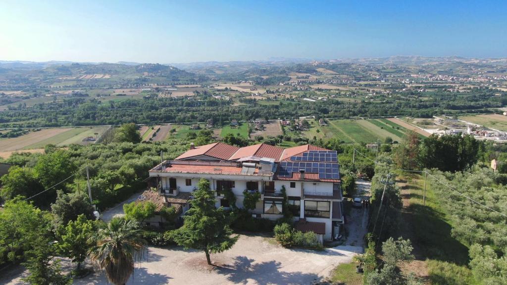 an aerial view of a house with solar panels on its roof at Residence Ristorante Baobab in Controguerra