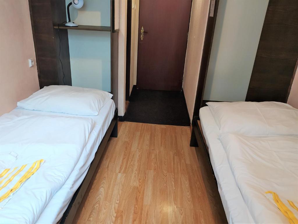 Postel nebo postele na pokoji v ubytování Hotel Tatranec