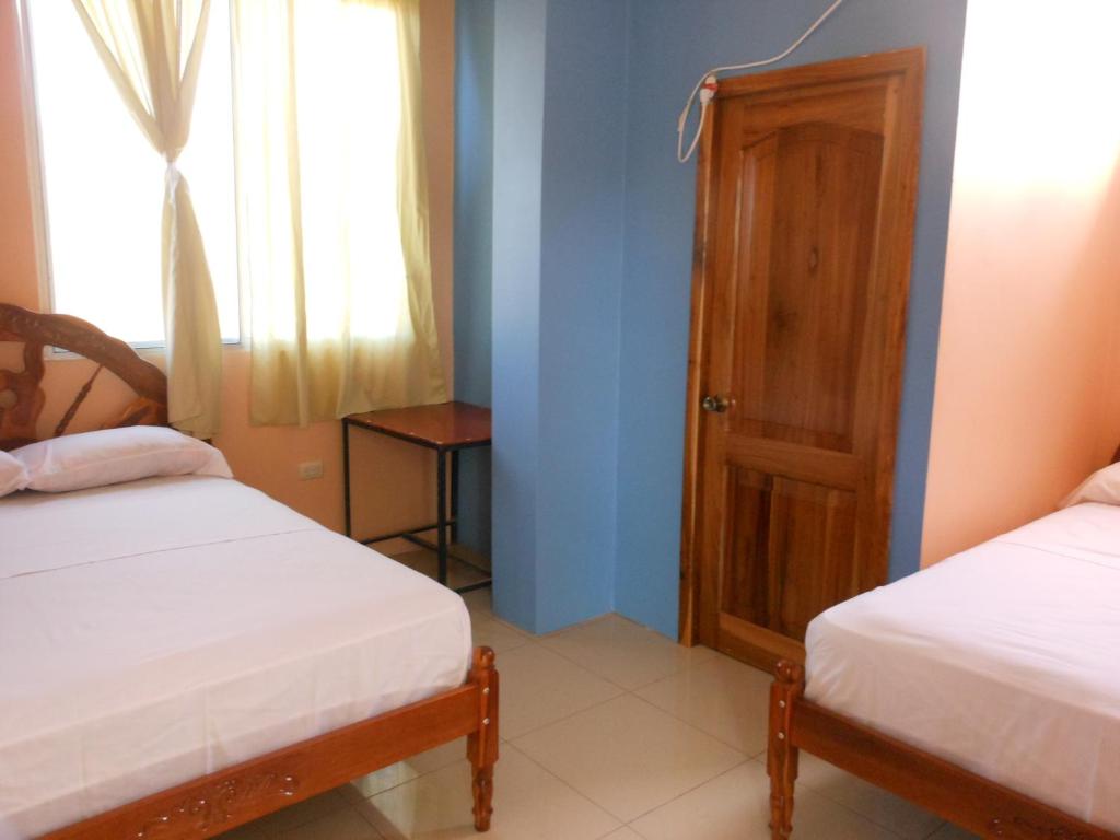 Postel nebo postele na pokoji v ubytování Hostal Alcazaba