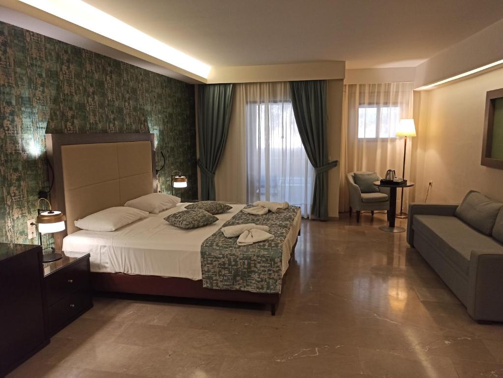 Postel nebo postele na pokoji v ubytování King Minos Hotel