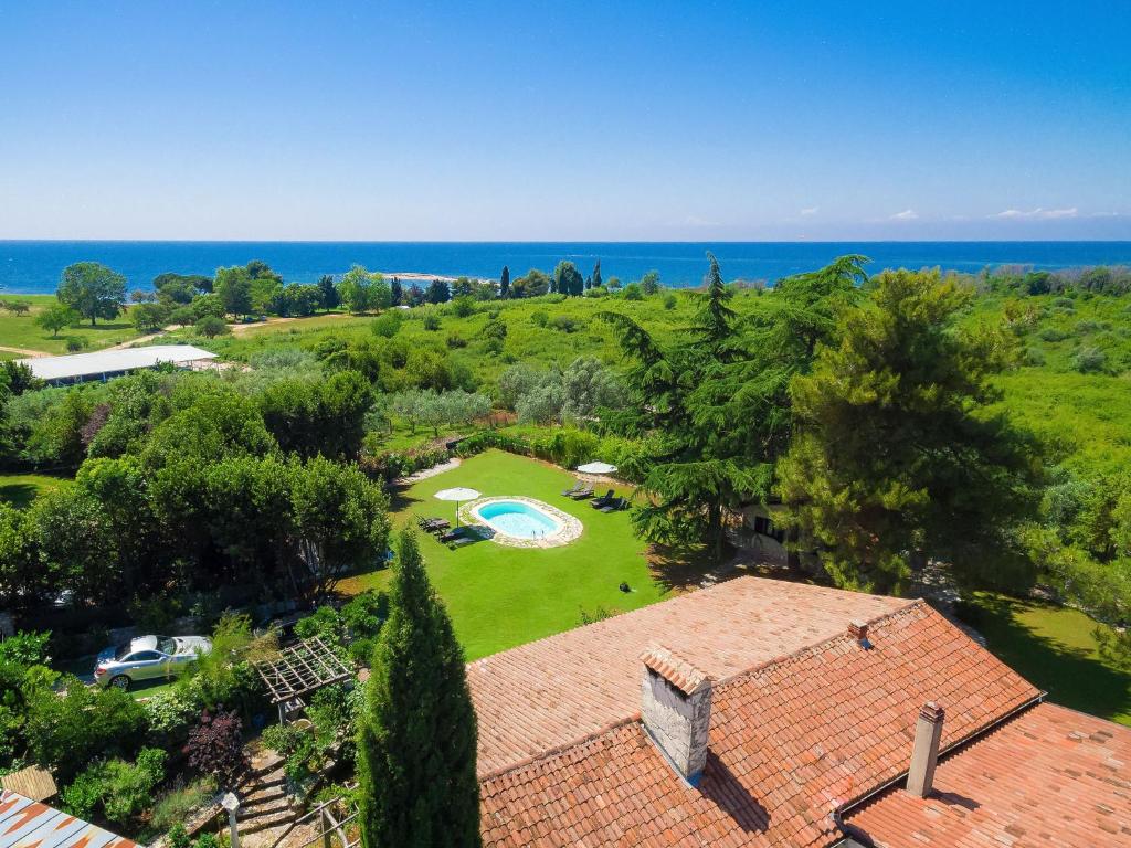 an aerial view of a house with a garden and the ocean at Villa Moira by Interhome in Umag