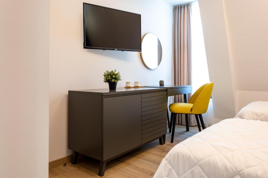 Postel nebo postele na pokoji v ubytování Grand Central Hotel