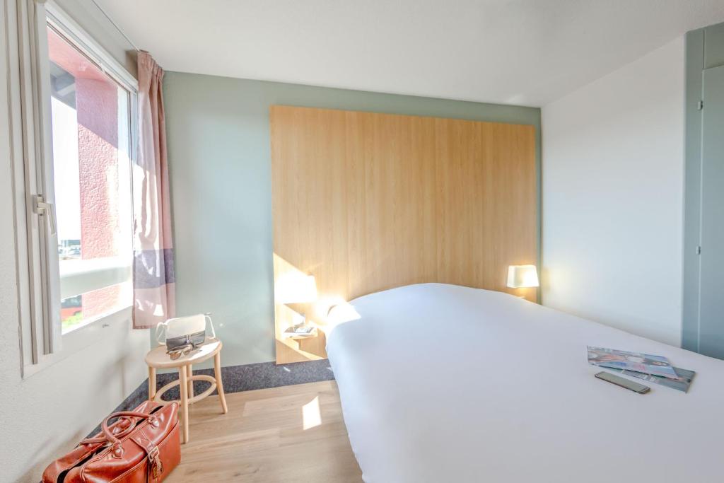 Postel nebo postele na pokoji v ubytování B&B HOTEL PERPIGNAN Nord Aéroport