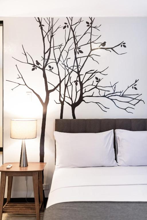 Postel nebo postele na pokoji v ubytování Artemis Place Makati Hotel