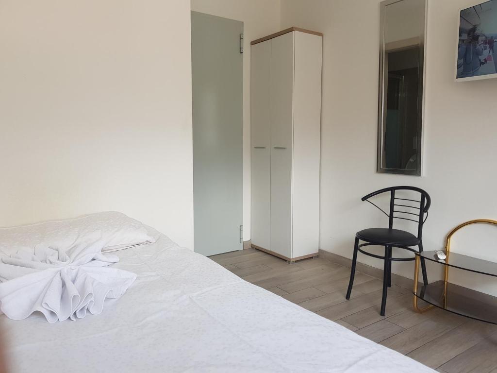Postel nebo postele na pokoji v ubytování Bellinzona Rooms
