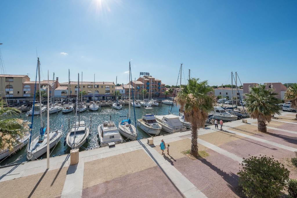 a group of boats docked in a marina at locaportleucate in Leucate