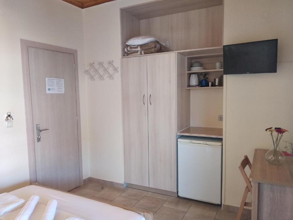 Kuchyň nebo kuchyňský kout v ubytování Gogo's - Γωγώ Rooms & Studios