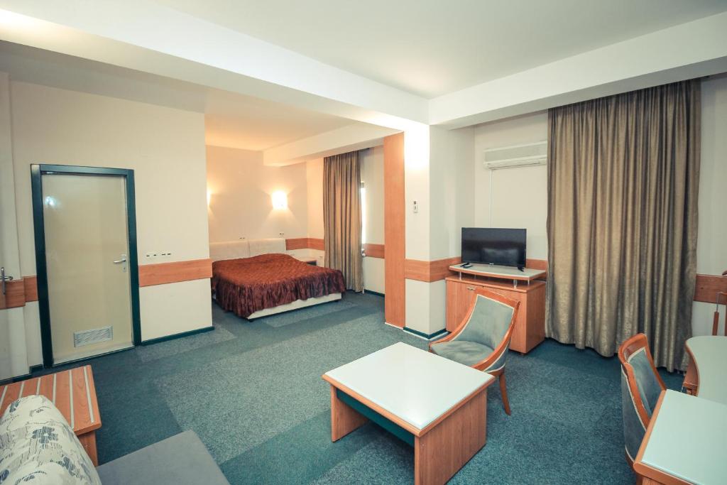 TV a/nebo společenská místnost v ubytování Hotel Cingo