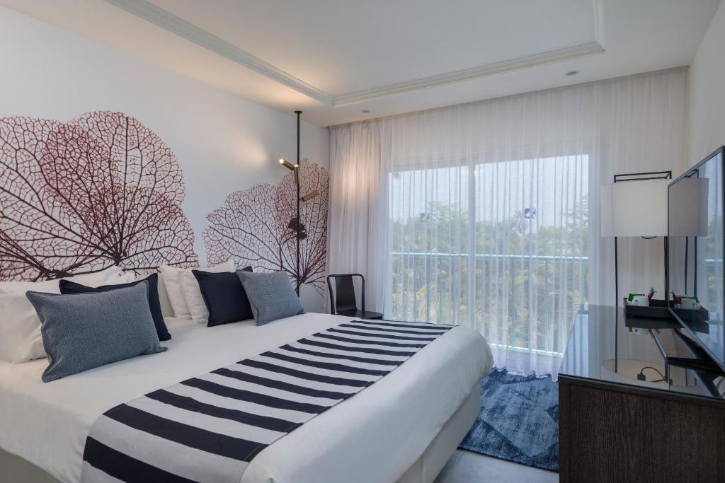 Ein Bett oder Betten in einem Zimmer der Unterkunft Yam Suf by Isrotel Collection