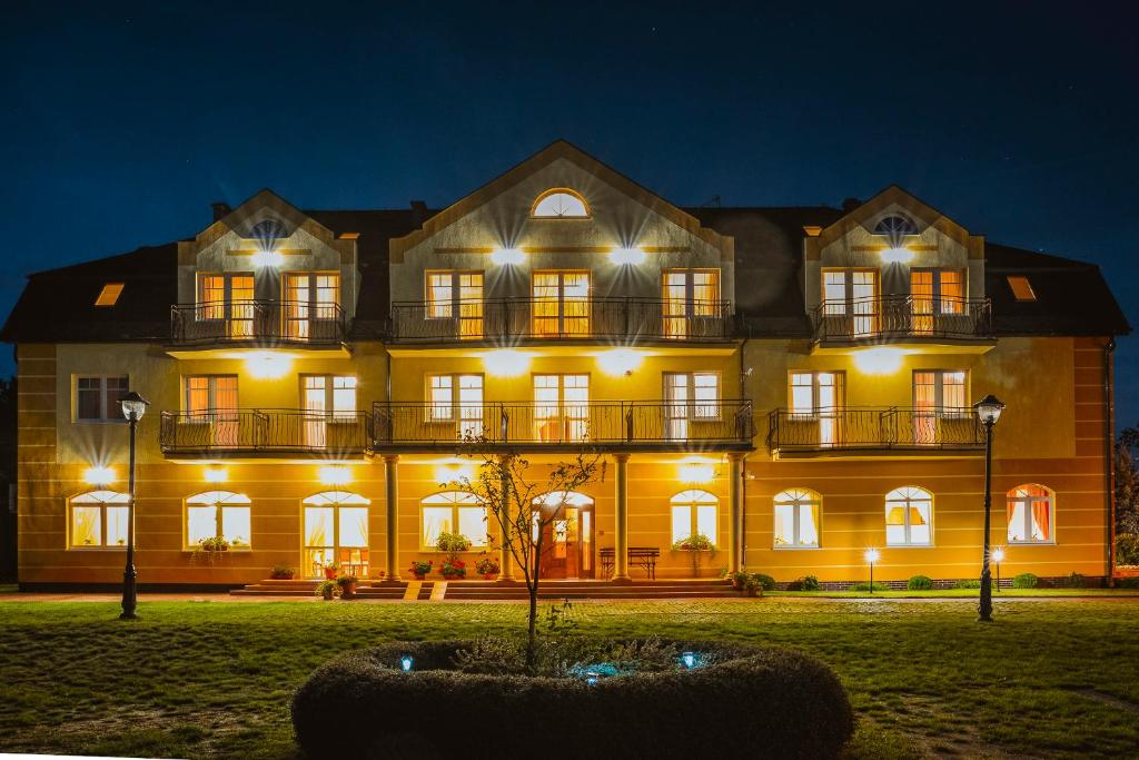 a large building with lights in front of it at Villa Sylvia in Dźwirzyno