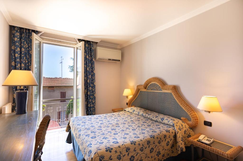 Postel nebo postele na pokoji v ubytování Hotel Dei Tigli