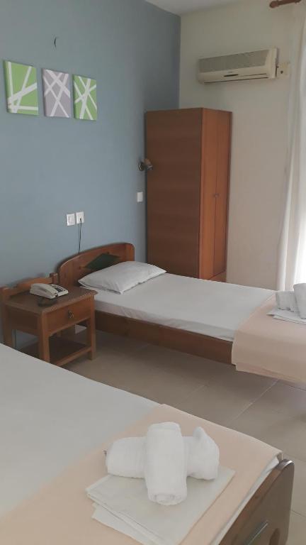 Postel nebo postele na pokoji v ubytování Hotel Lena