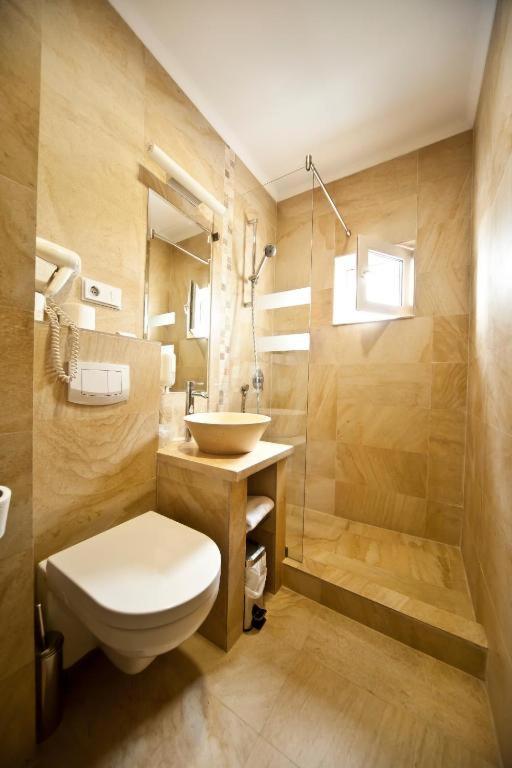 Koupelna v ubytování Hotel Confort