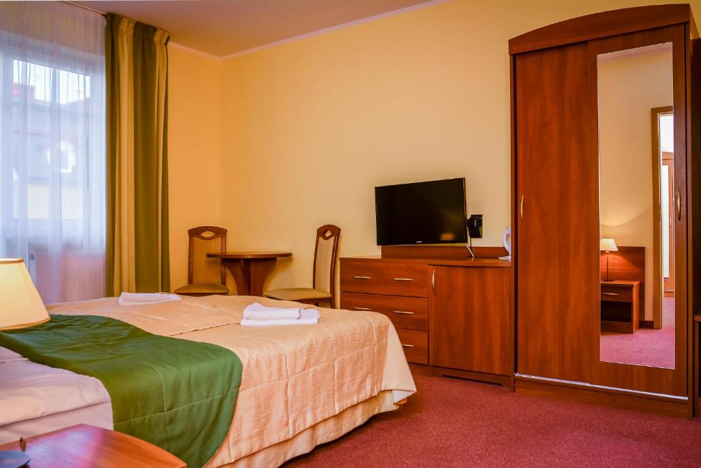Łóżko lub łóżka w pokoju w obiekcie Villa Sylvia