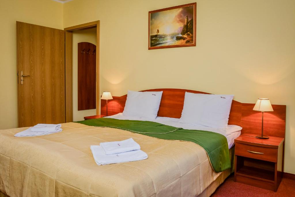Łóżko lub łóżka w pokoju w obiekcie Villa Sylvia