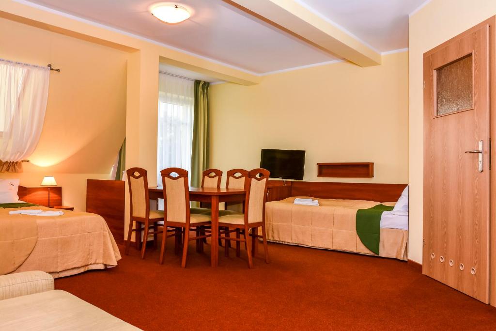 Łóżko lub łóżka w pokoju w obiekcie Villa Sylvia
