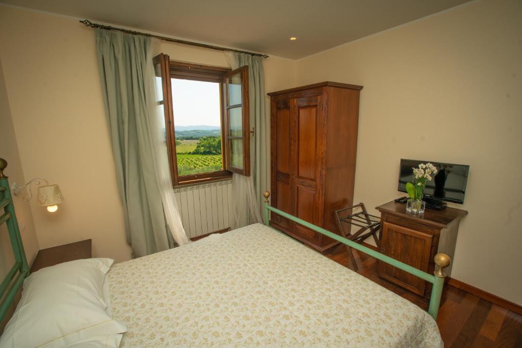 A bed or beds in a room at Agriturismo Le Anfore