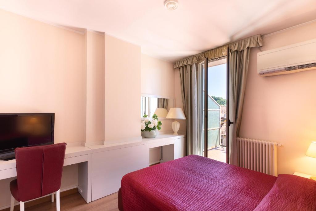 TV a/nebo společenská místnost v ubytování Hotel Dei Tigli