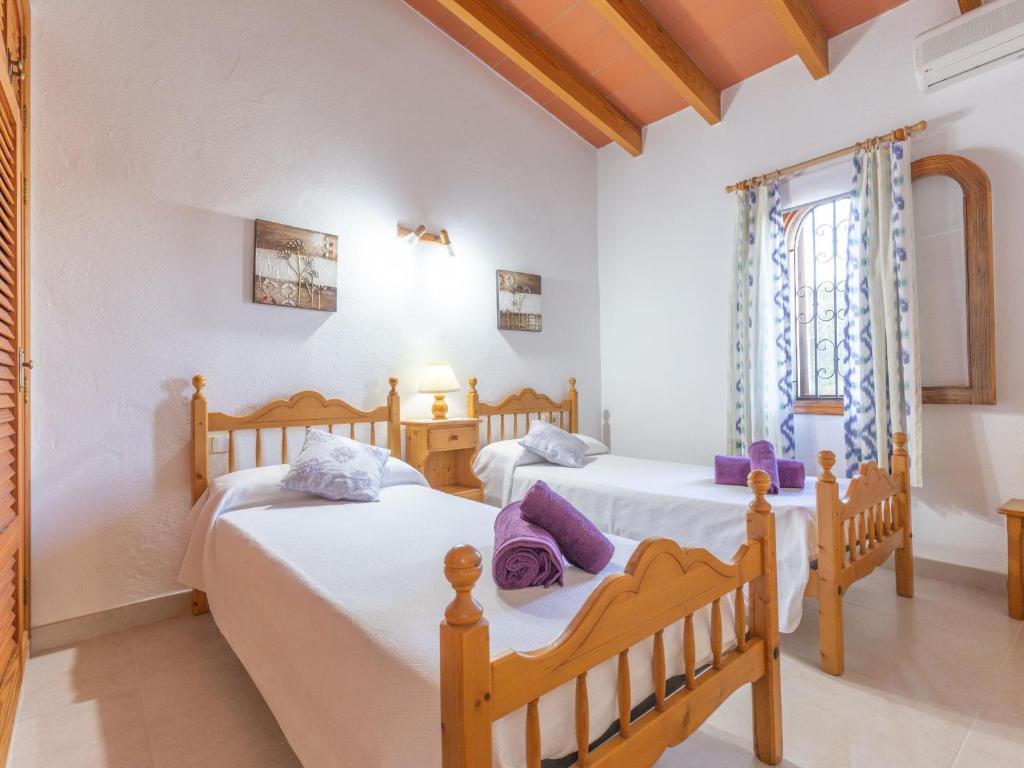 Postel nebo postele na pokoji v ubytování Holiday Home Ca Na Guerrera by Interhome