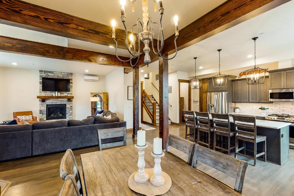 a living room and dining room with a couch and a table at Big Hill Retreat in Cle Elum