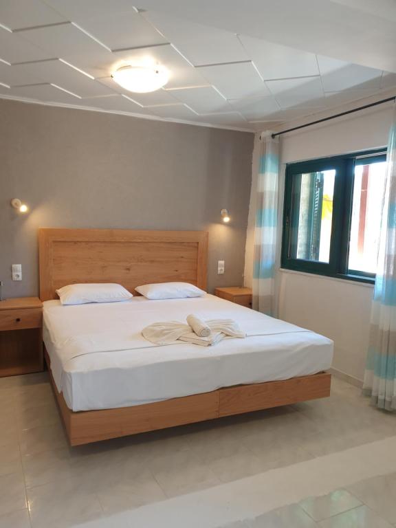 Postel nebo postele na pokoji v ubytování Apartments and Studios Xenophon