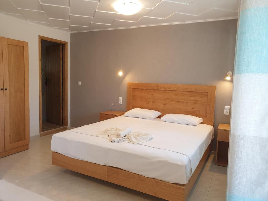 Postel nebo postele na pokoji v ubytování Apartments and Studios Xenophon