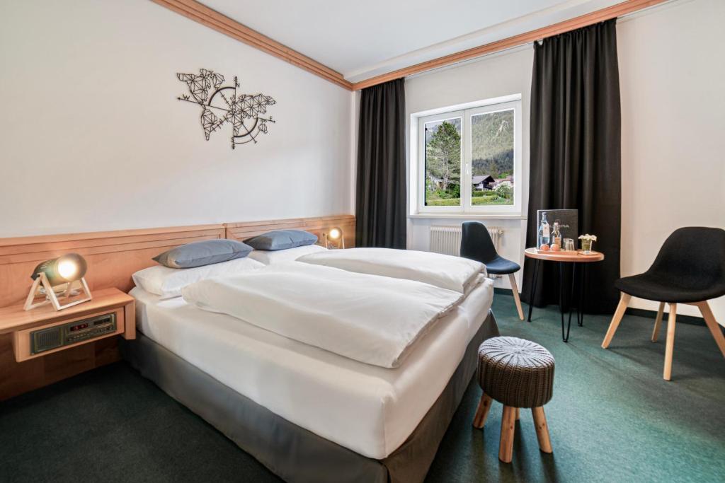 Postel nebo postele na pokoji v ubytování Boutique Hotel Olympia