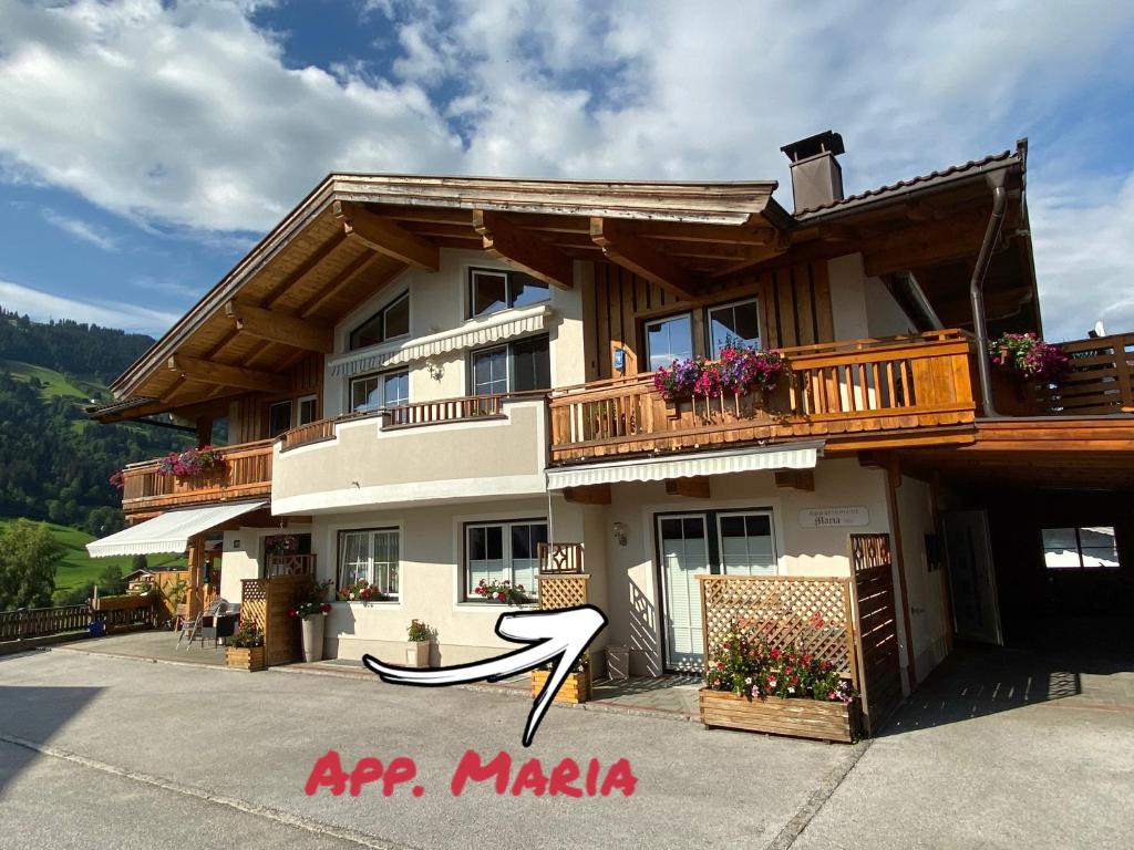 a large building with balconies on the side of it at Appartement Maria in Westendorf