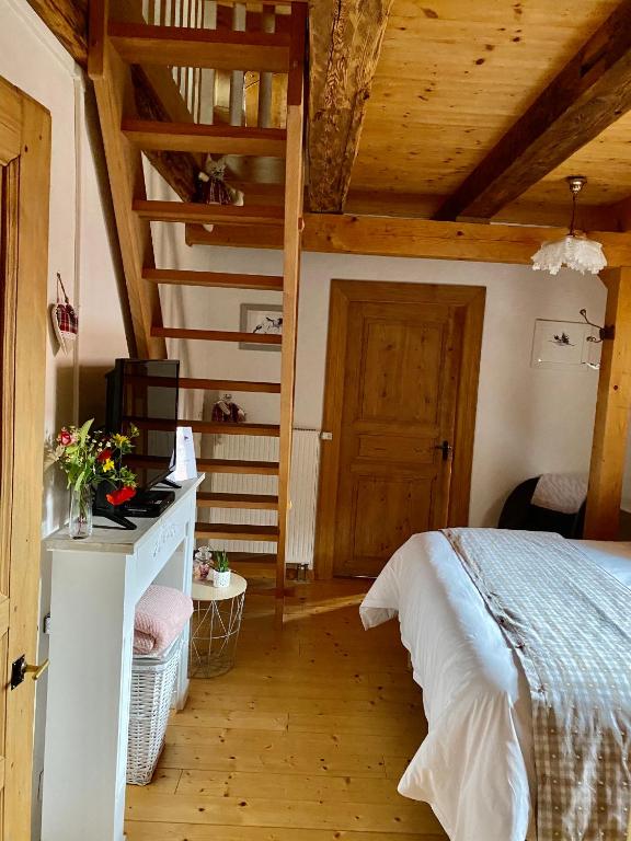 Postel nebo postele na pokoji v ubytování Le Nid de Cigognes