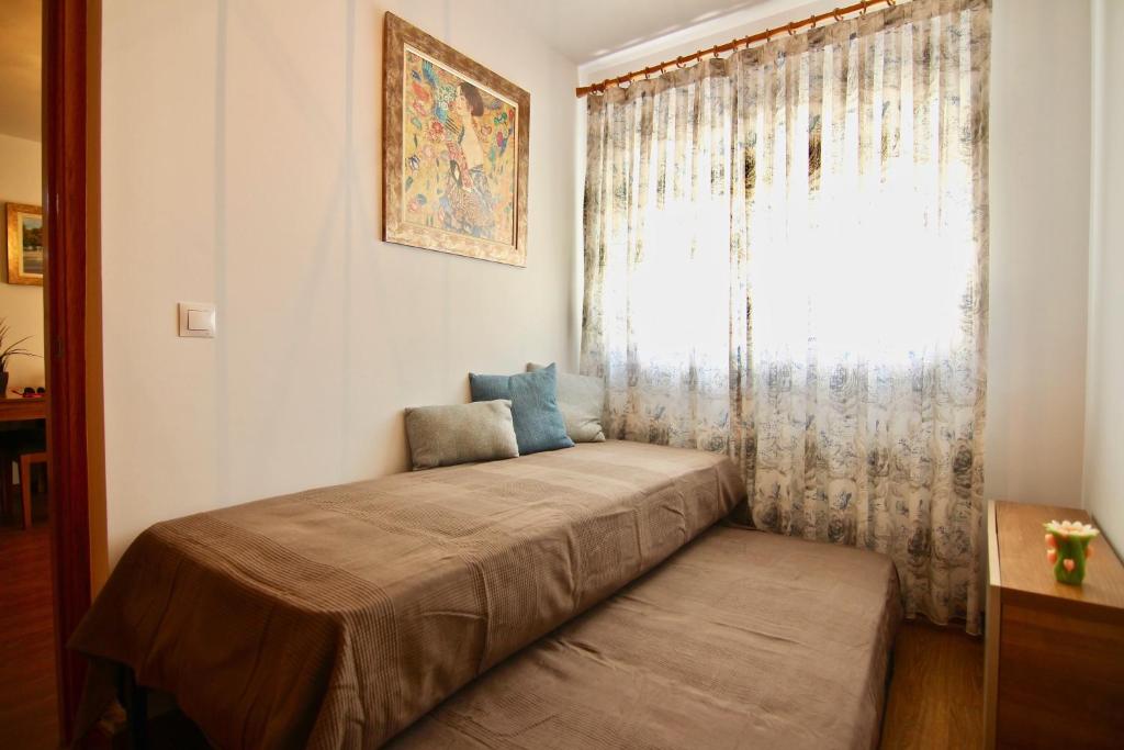 Łóżko lub łóżka w pokoju w obiekcie Apartamento CONFORTABLE junto al Mercado