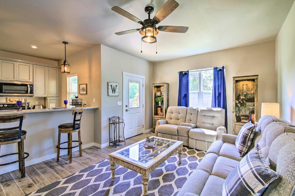 a living room with a couch and a table at Hill Country Escape Hike, Swim, and Drink Wine in Fredericksburg