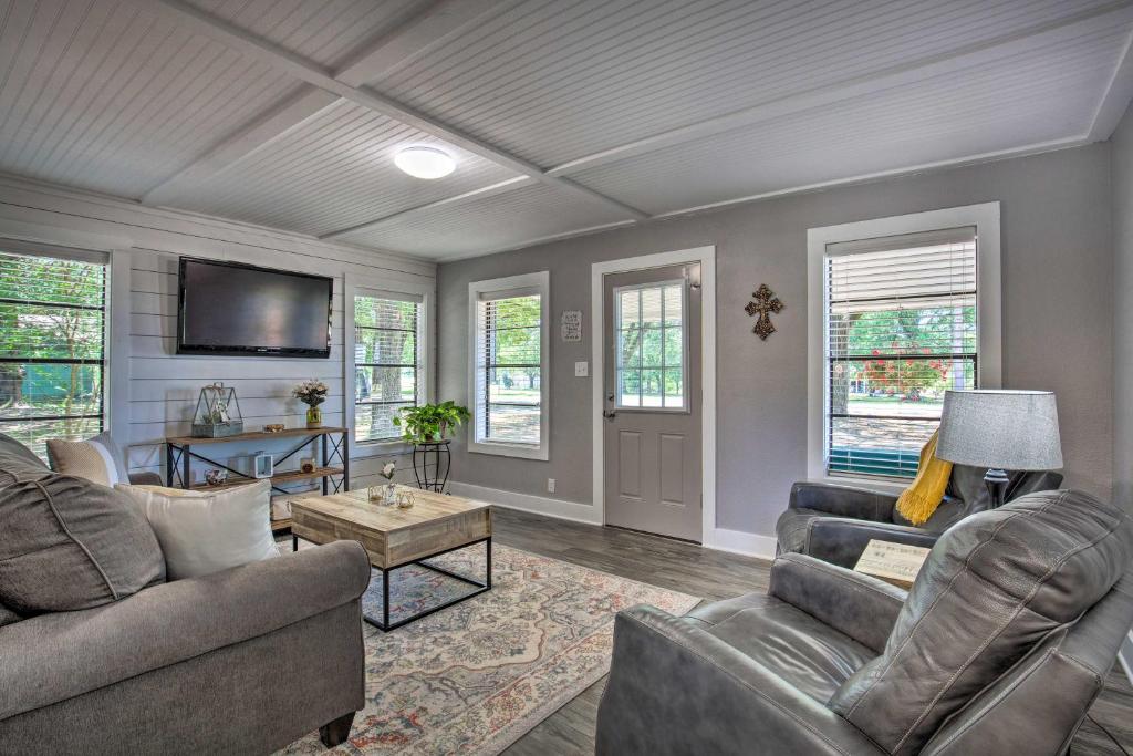 a living room with two couches and a tv at Quaint Home with Deck and Grill - Mins to Lake Fork! in Emory