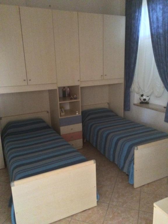 Posteľ alebo postele v izbe v ubytovaní Porto Cesareo Appartamento a 300 metri dal mare