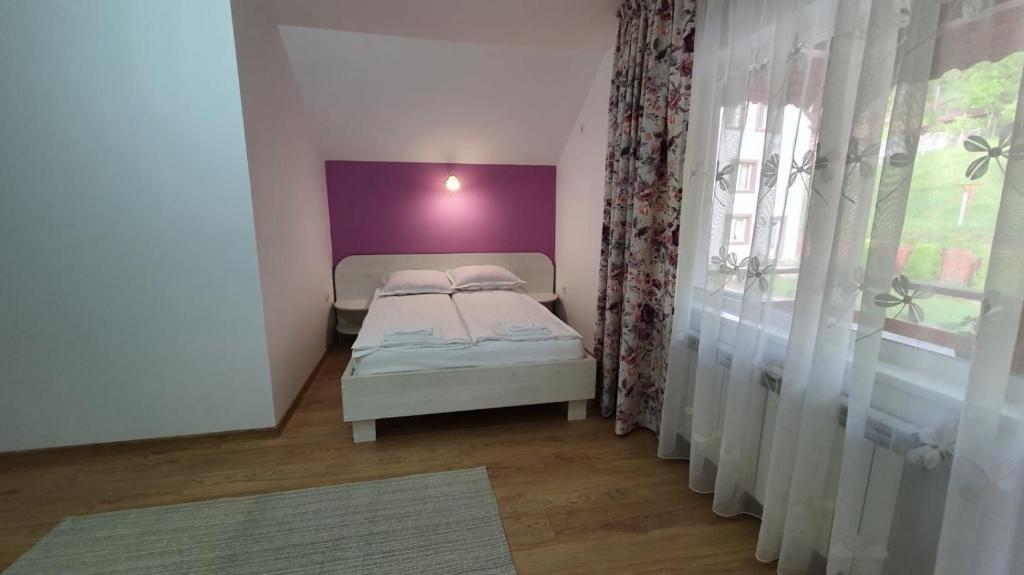 Postel nebo postele na pokoji v ubytování Casa Balint