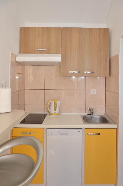 Kuchyň nebo kuchyňský kout v ubytování Apartments Tomas