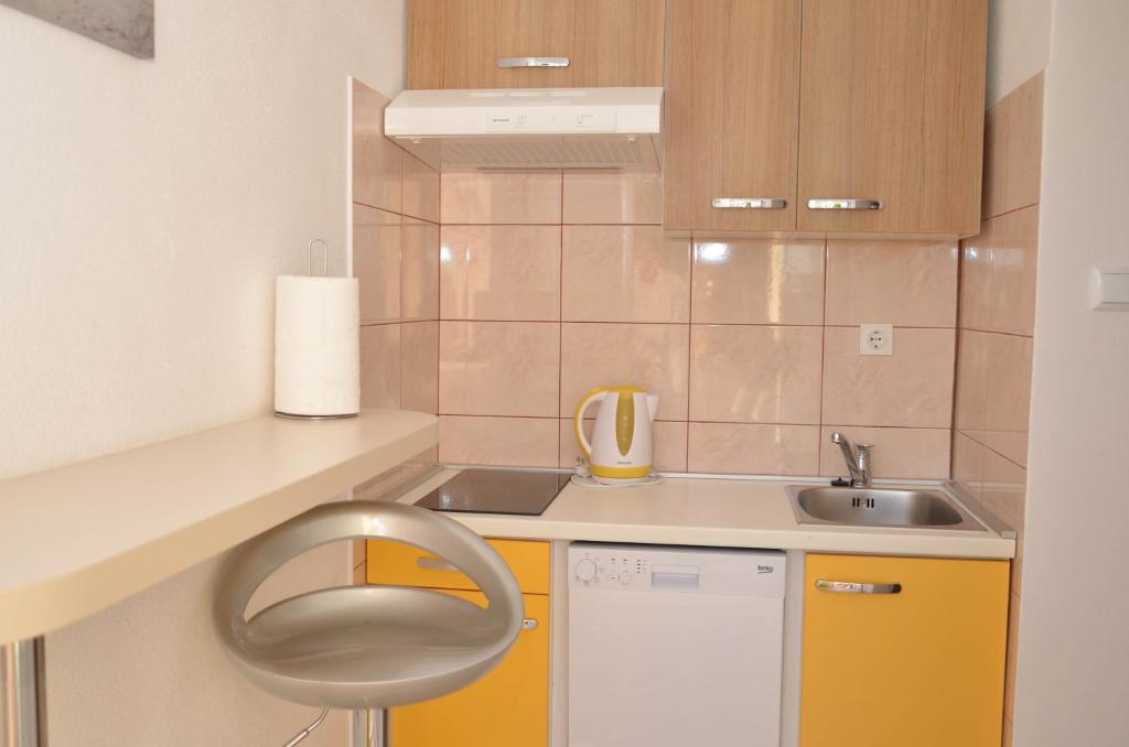 Kuchyň nebo kuchyňský kout v ubytování Apartments Tomas