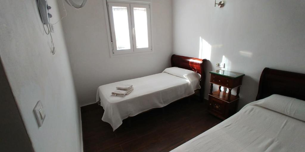 Posteľ alebo postele v izbe v ubytovaní Casas Turísticas Bajamar