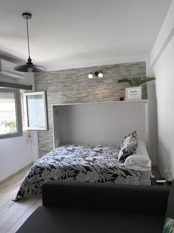 Posteľ alebo postele v izbe v ubytovaní Sol Ohana Apartamento Boutique