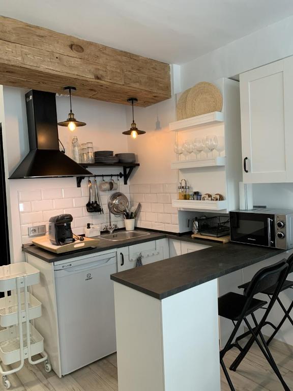 Kuchyňa alebo kuchynka v ubytovaní Sol Ohana Apartamento Boutique