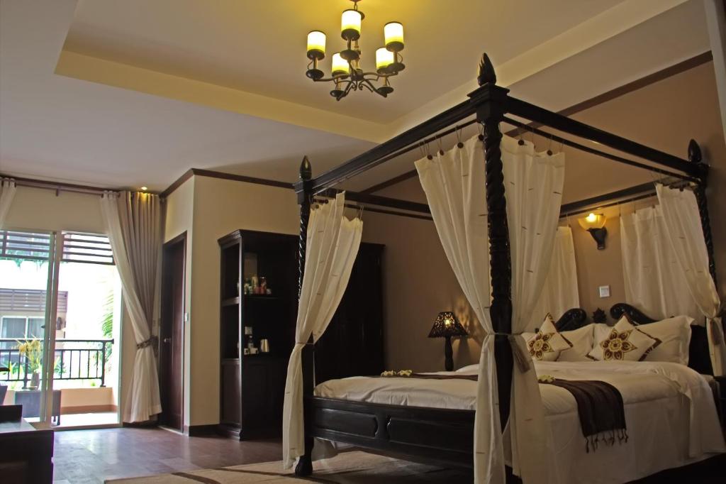 Postel nebo postele na pokoji v ubytování Bali Hotel