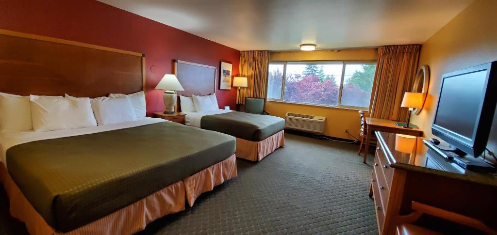 Letto o letti in una camera di Olympic View Inn
