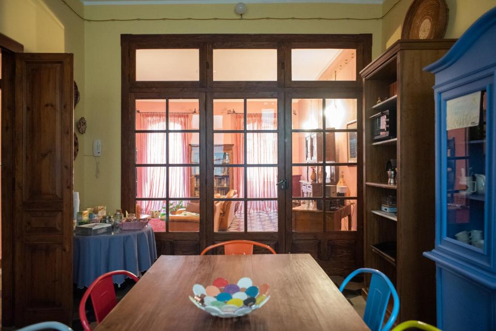 a dining room with a wooden table with a bowl of eggs on it at La Babbajola in Iglesias