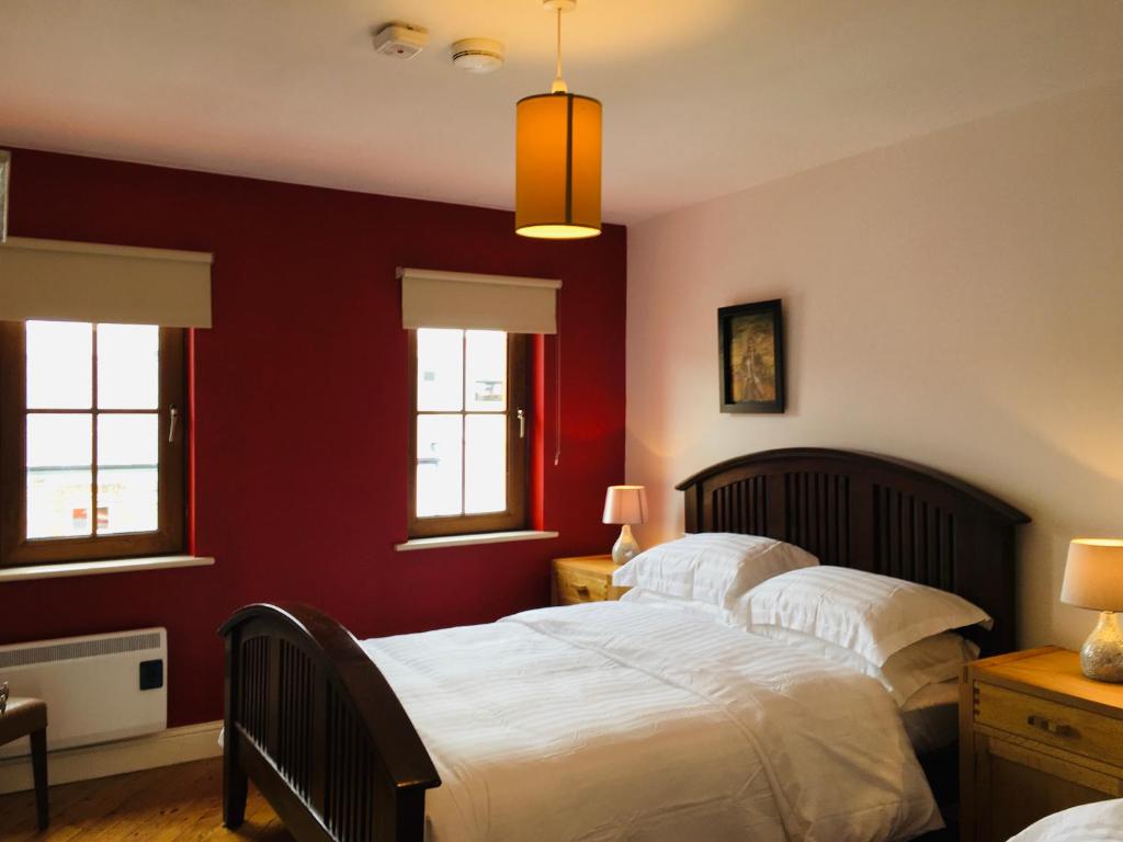 Postel nebo postele na pokoji v ubytování Apartment 8, Clifden Bay Apartments