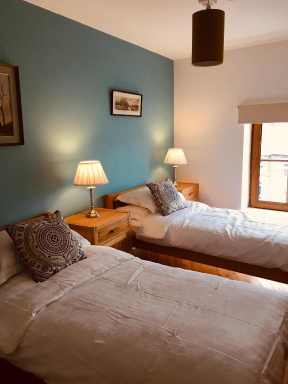 Postel nebo postele na pokoji v ubytování Apartment 8, Clifden Bay Apartments