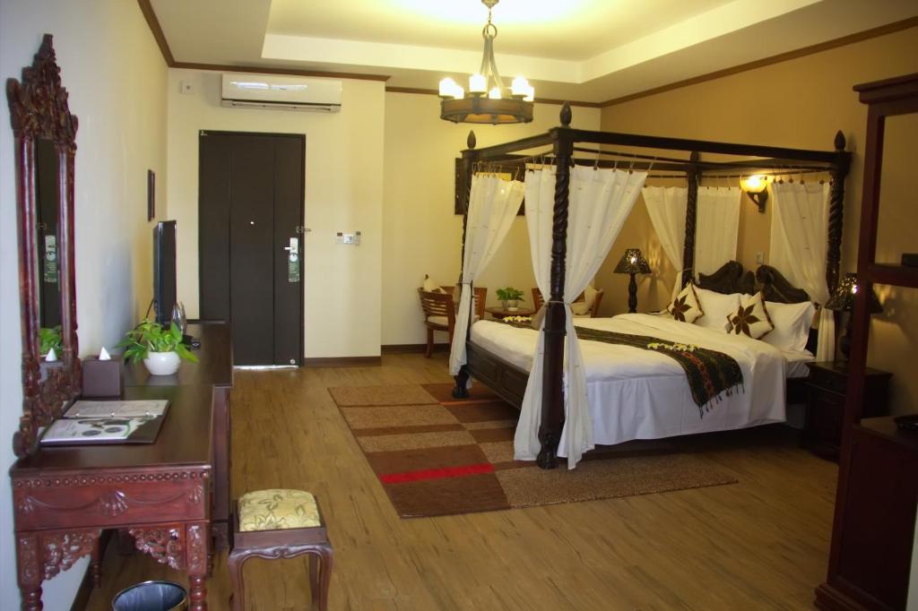Postel nebo postele na pokoji v ubytování Bali Hotel
