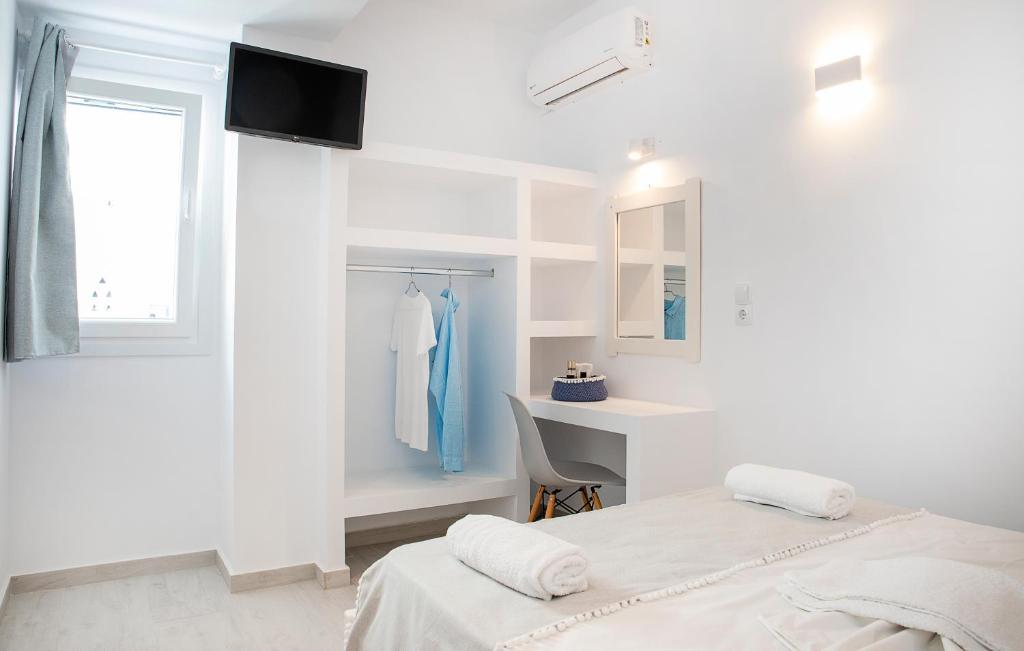 Postel nebo postele na pokoji v ubytování Grozos Rooms