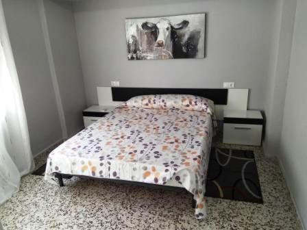Postel nebo postele na pokoji v ubytování Torrevieja Playa Cura