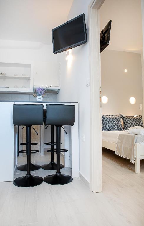 Postel nebo postele na pokoji v ubytování Grozos Rooms