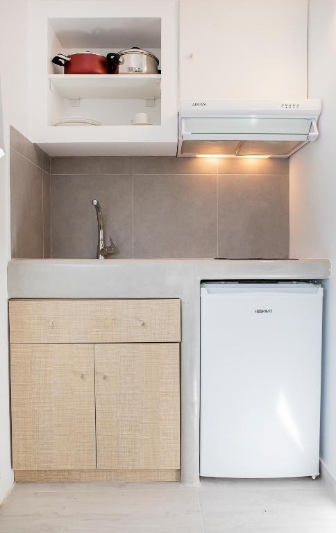 Kuchyň nebo kuchyňský kout v ubytování Grozos Rooms